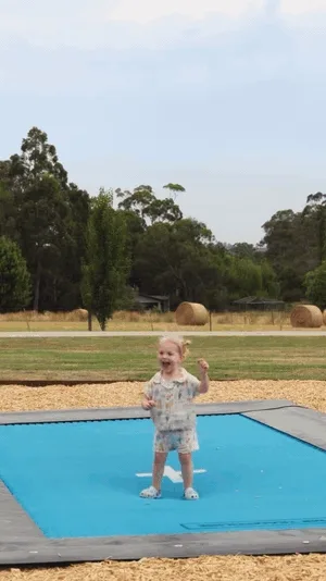 Looping clip of all nine of Rob and Alicia's kids taking turns on their in-ground Mr Trampoline